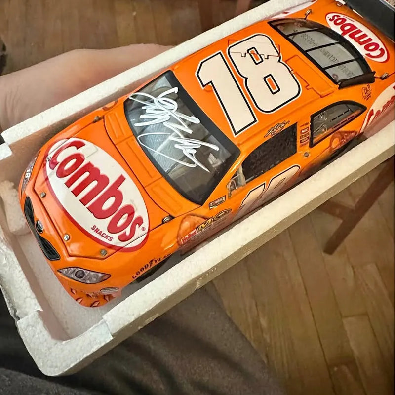 1:24 signed diecast race car, orange with white 18 and Combos logos
