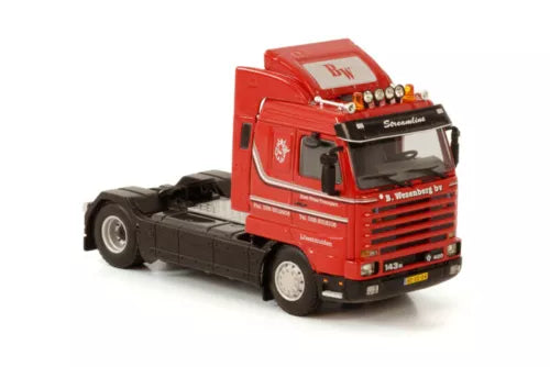 Red cab diecast truck model with black chassis, front view