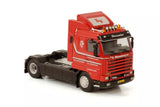 Red cab diecast truck model with black chassis, front view