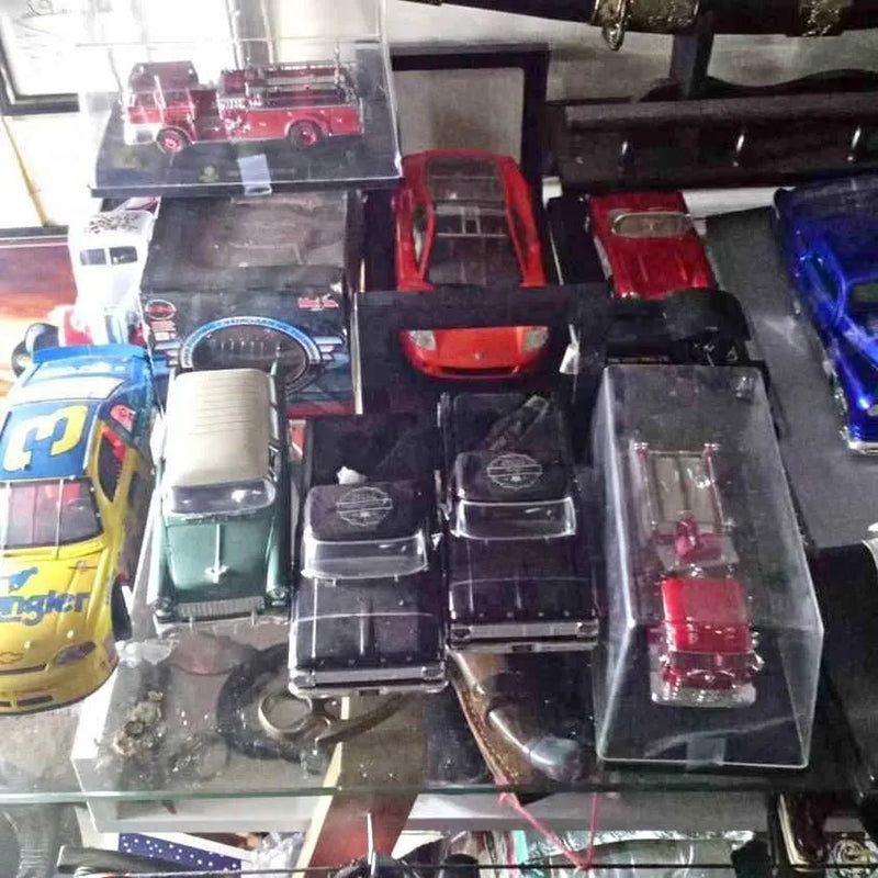 Large diecast car collection showing multiple model cars in display cases