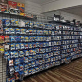 Diecast toy car blister packs on display, multiple models in blue packaging