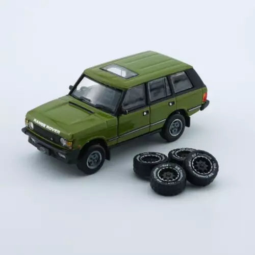 Green 1:64 diecast Range Rover Classic LSE toy SUV with spare tires
