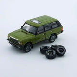 Green 1:64 diecast Range Rover Classic LSE toy SUV with spare tires