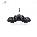FLYXINSIM mini FPV quadcopter with front camera, dark frame, and antenna