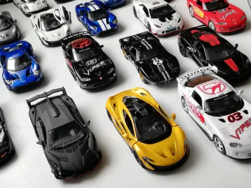 Die-cast sports car toy models, assorted colors, 1:36 scale, front views on display
