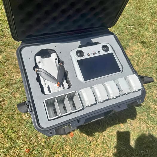 Foldable drone accessories kit in hard case, including remote and spare batteries