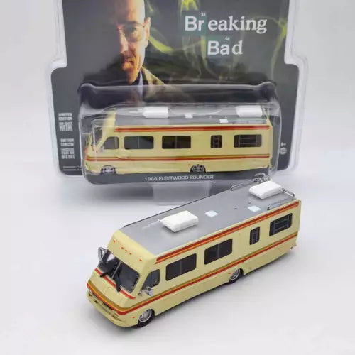 Diecast RV toy with cream body, orange stripe, side windows and black wheels