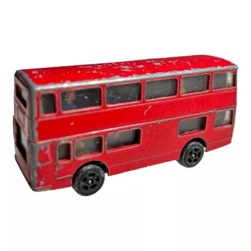 Red diecast double-decker bus model with black wheels and windows