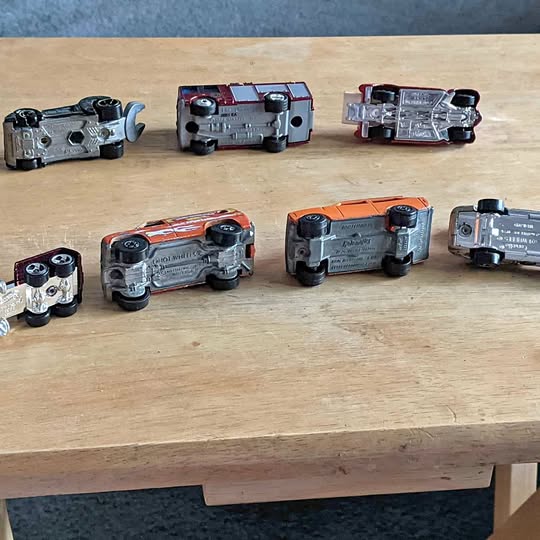 1/64 diecast model cars, five vehicles shown from multiple angles