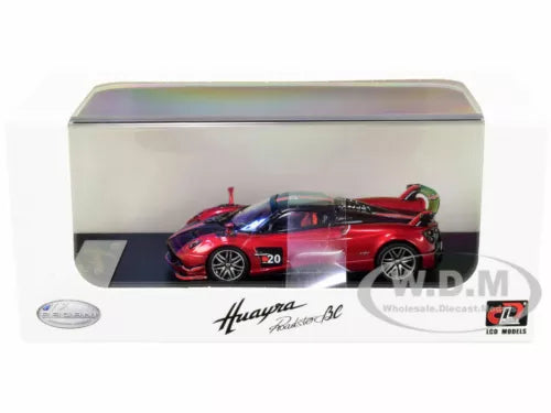 Red roadster diecast model car in clear display case, numbered 20 on side