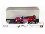 Red roadster diecast model car in clear display case, numbered 20 on side