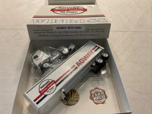 Diecast tractor-trailer model in retail box, red-and-white AGWAY graphics