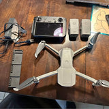DJI Mavic Air 2 drone with controller and two spare batteries, folded arms