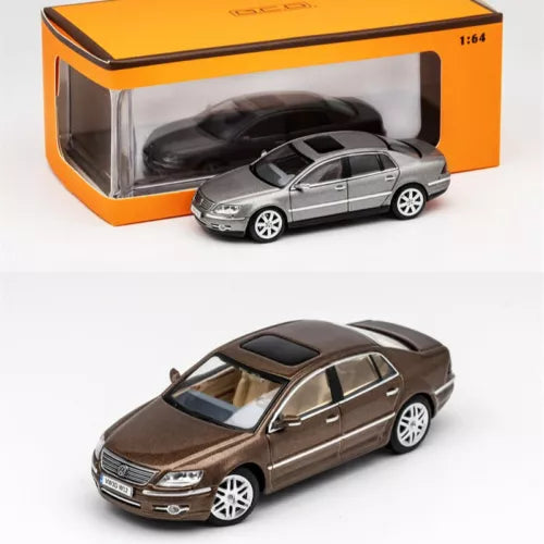 1:64 LHD diecast model car toy in brown and grey, shown out of box