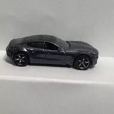 Black Fisker Karma diecast car, side view, detailed wheels and windows