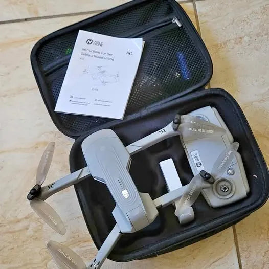 Drone Spring TX drone with remote and accessories in black zippered carrying case