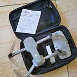 Drone Spring TX drone with remote and accessories in black zippered carrying case