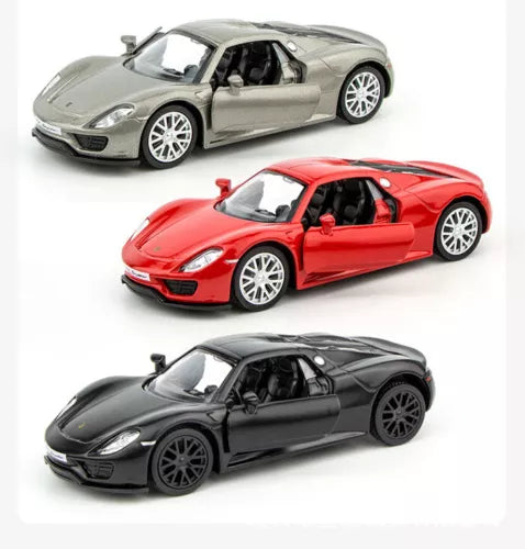 Diecast sports car model set, three Porsche-style cars in gray, red, and black.