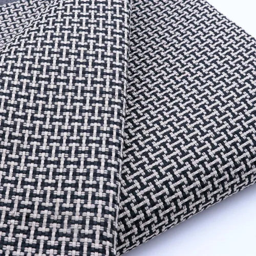 Model car display box with black-and-white tweed fabric exterior, close-up corner seam