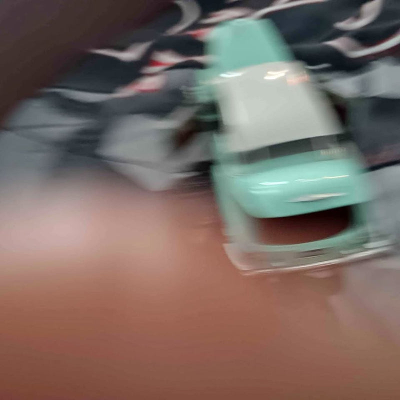 Teal diecast car front with chrome bumper