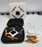 Nano quadcopter drone with orange propellers, in black carrying case and retail box