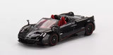 Black Pagani Huayra Roadster diecast model car with red interior and open-top design