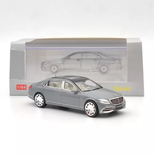 Grey 1:64 diecast sedan toy car with silver wheels, in display box