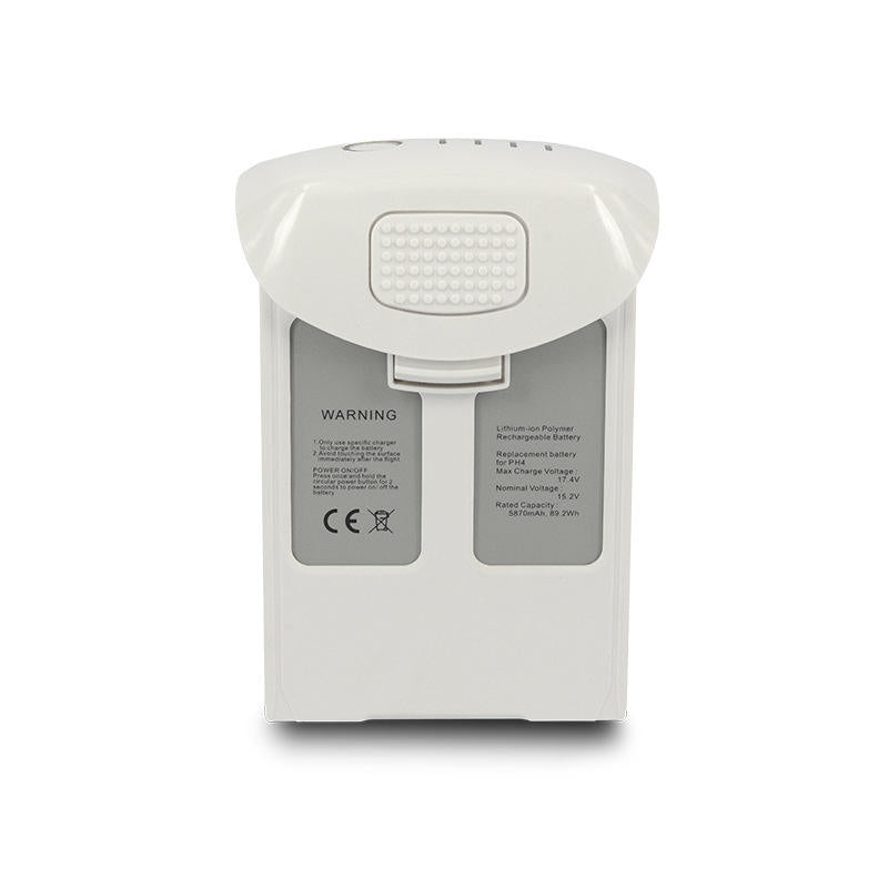 White drone battery pack with warning labels and connector pins