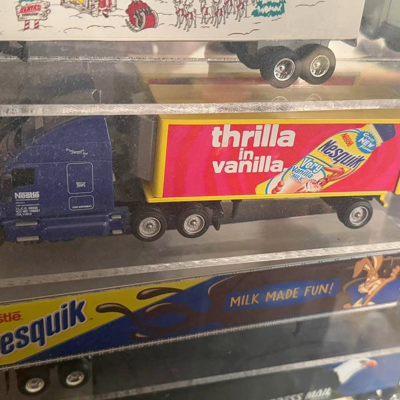 1/64 scale diecast truck, yellow and blue, with brand graphics