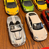 Diecast toy cars assortment, silver, white, yellow, green and red models