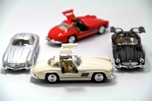 Set of 4 diecast toy cars in white, red, black, and silver.