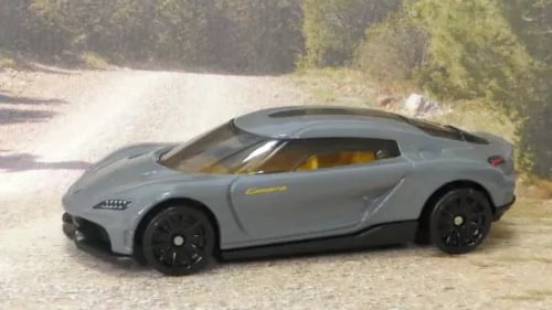 Dark grey 1:64 diecast sports car with side profile