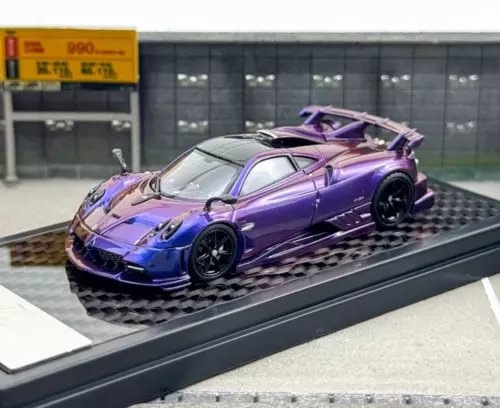 Purple sports diecast model car with detailed bodywork, 1:64 scale.