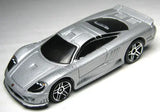 Silver diecast sports car with black hood and roof, detailed wheels