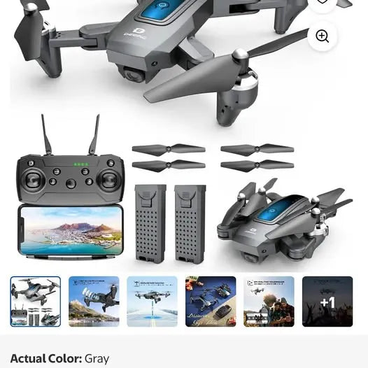 Gray camera drone kit with controller, two batteries, and four propellers