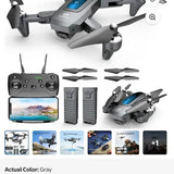 Gray camera drone kit with controller, two batteries, and four propellers