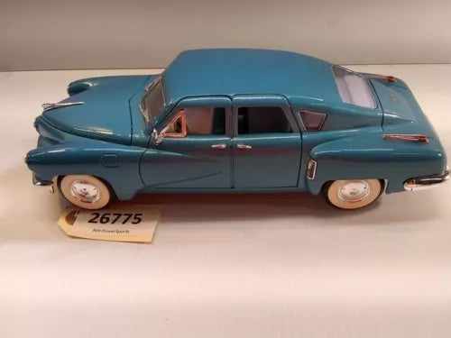Blue diecast Tucker Torpedo car model replica with side doors and front grille