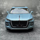 Blue 1:18 diecast sedan model car, front view with grille and headlights