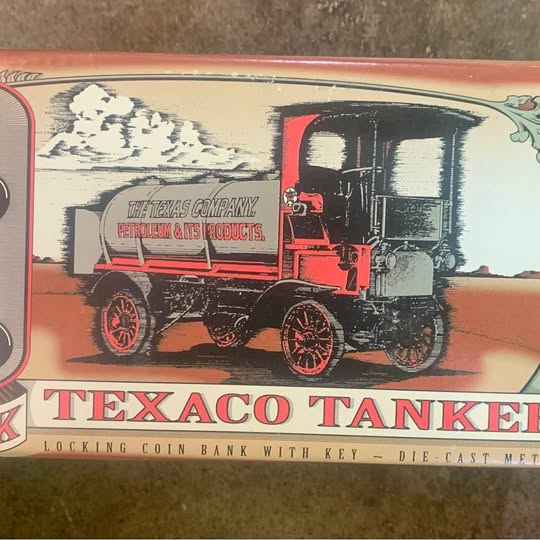 Vintage diecast tanker coin bank with key, Texaco logo and red truck design