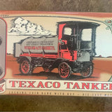Vintage diecast tanker coin bank with key, Texaco logo and red truck design