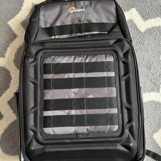 Black Lowepro drone backpack with padded front organizer panel
