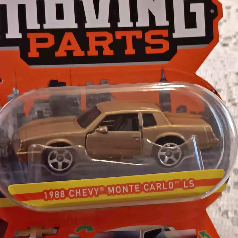 Brown diecast 1988 Chevy Monte Carlo LS car with silver wheels in clear blister