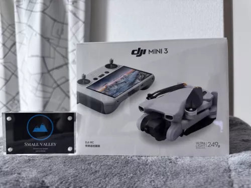 DJI Mini 3 drone with RC controller and mechanical gimbal, in gray packaging