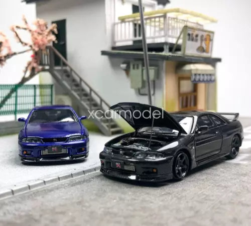 Diecast metal sports car toy set, black and blue front views