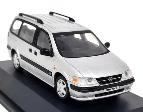 Silver diecast scale model van with front grille and headlights, detailed interior