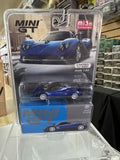 Blue diecast sports car model in clear blister pack, Mini GT 1/64 scale