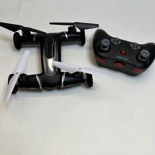 Black remote control drone with white propellers and handheld controller with buttons
