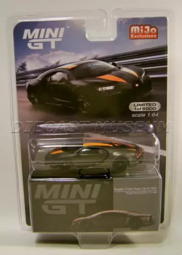 MINI GT diecast supercar model in blister pack, dark green with orange accents