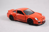 Orange 2010 Porsche 911 GT3 RS diecast toy car, front three-quarter view, black wheels