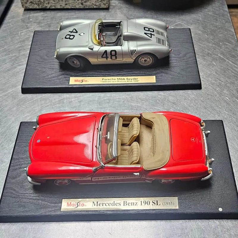 Red and silver diecast cars, front views on display stands